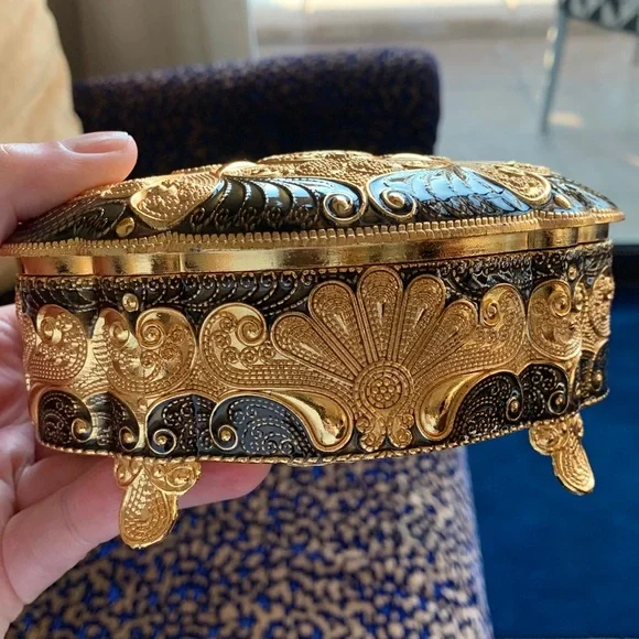 Absolutely stunning jewelry box , golden and black top, made in UAE. Must have!